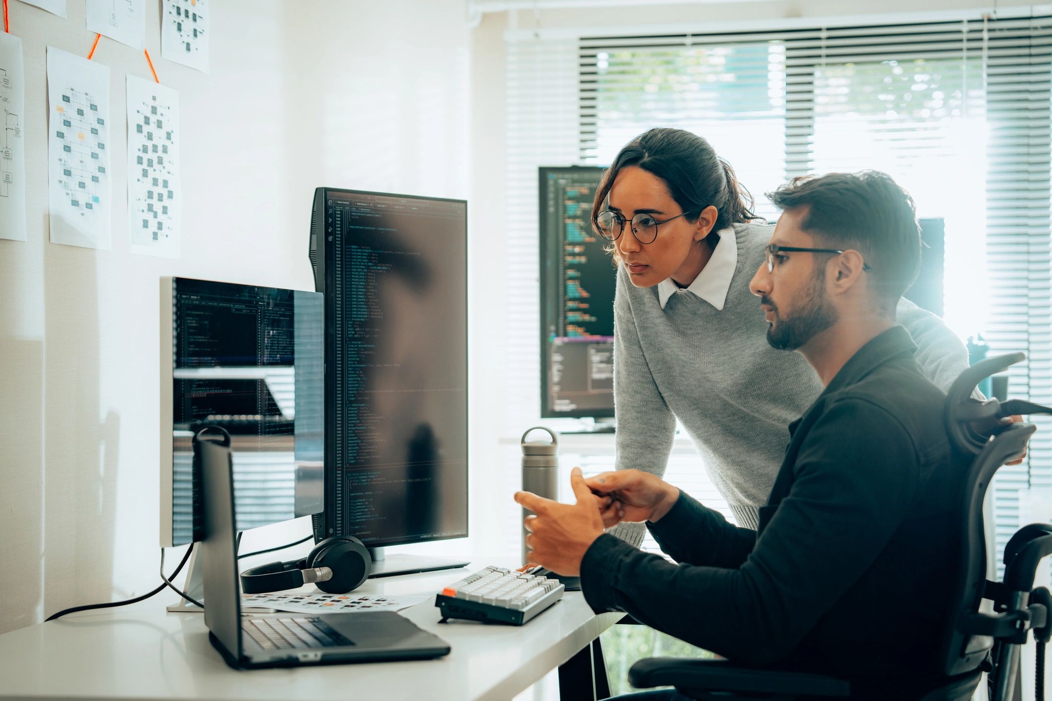 Cloud engineers collaborating in a modern office