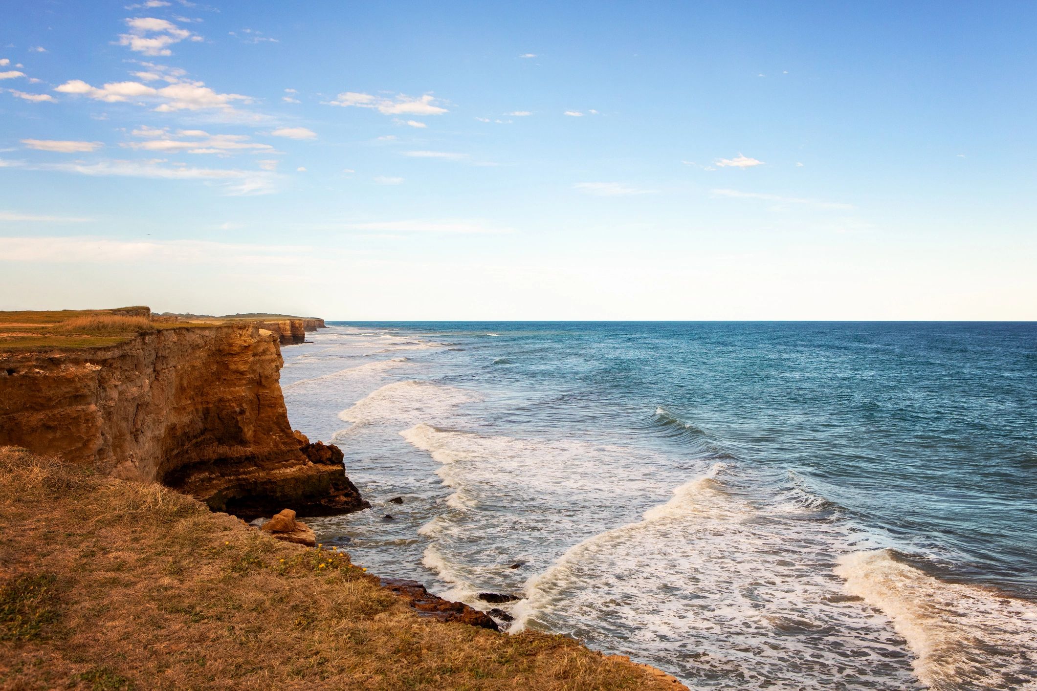 Ocean cliffs at sunset reflecting Pacific Coast inspiration